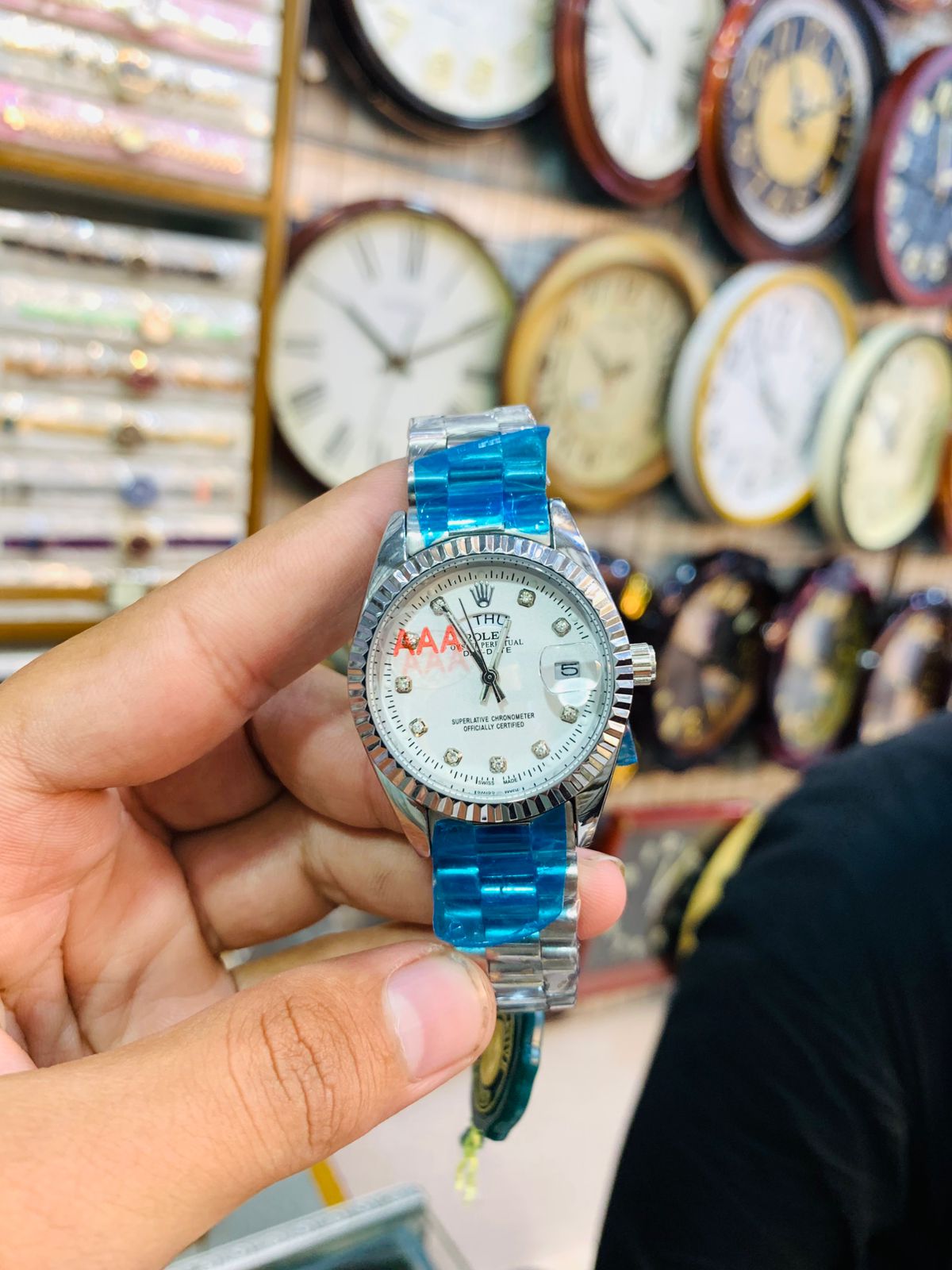 Classic silver ladies wrist watch with white dial and crystal-style markers.