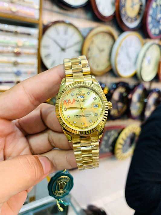 Luxury full-gold ladies wrist watch with matching gold dial and sparkling details