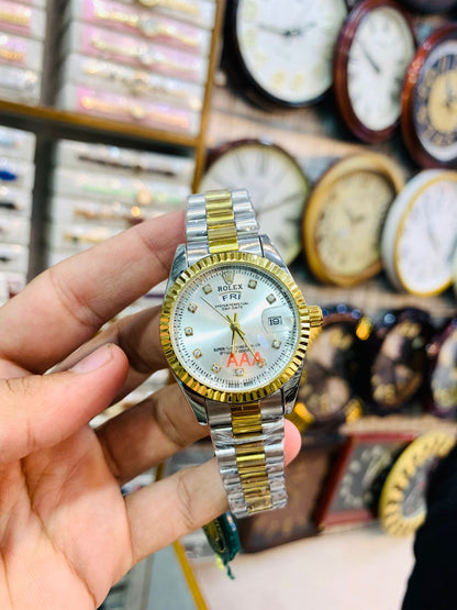 Elegant two-tone ladies wrist watch with white dial and gold-silver strap.